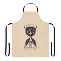 Person wearing an apron with a space-themed design, featuring planets, stars, and a shuttlecraft.