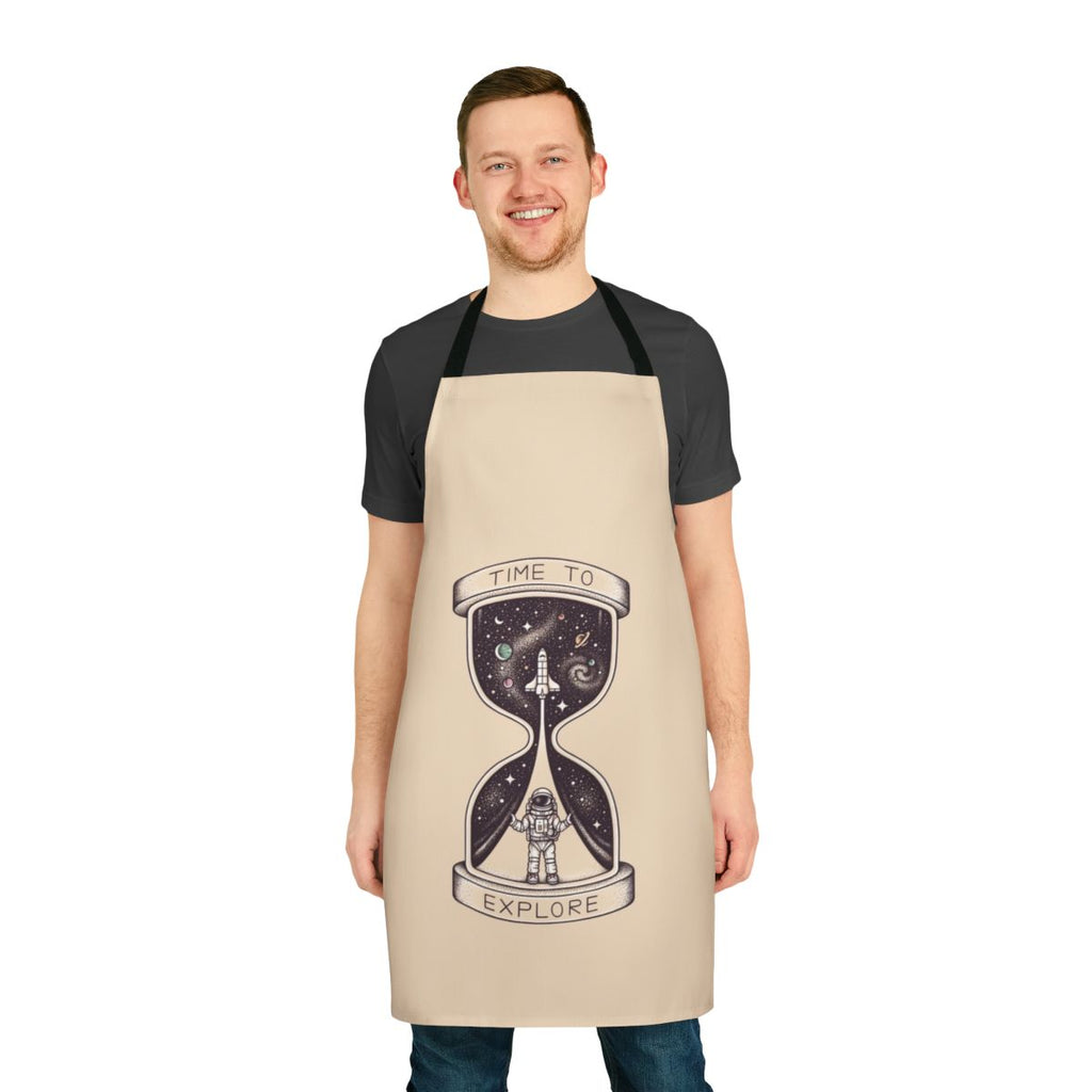Person wearing an apron with a space-themed design, featuring planets, stars, and a shuttlecraft.