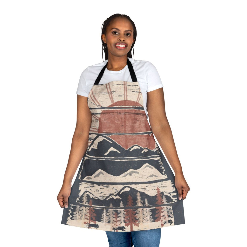 A stylish apron featuring a winter wilderness design with animals and scenic elements.
