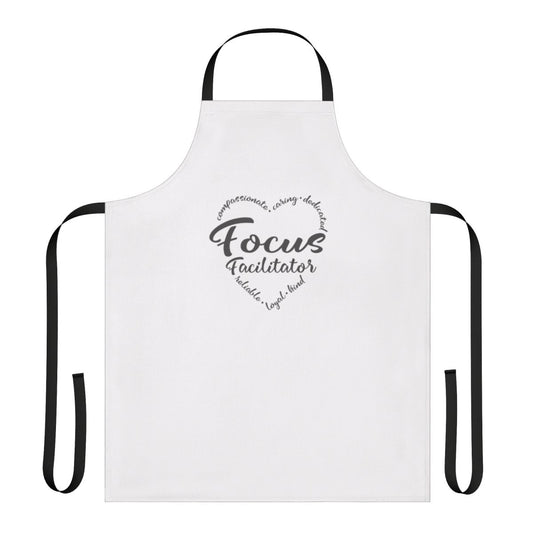 Facilitator wearing a navy blue apron with "Focus Group Facilitator" text
