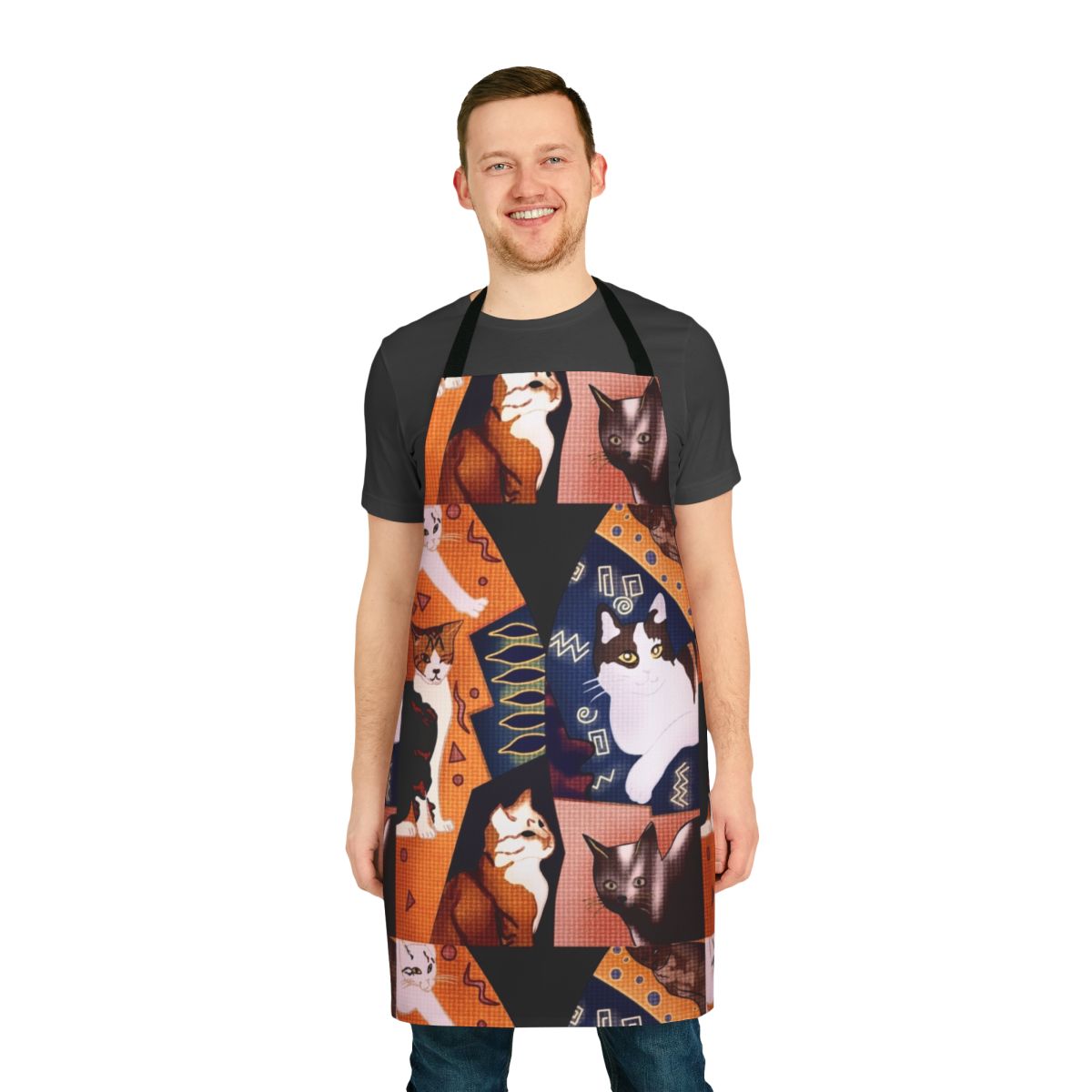 A black and white apron featuring an illustration of Freddie Mercury in a funky waistcoat design with cute cats.