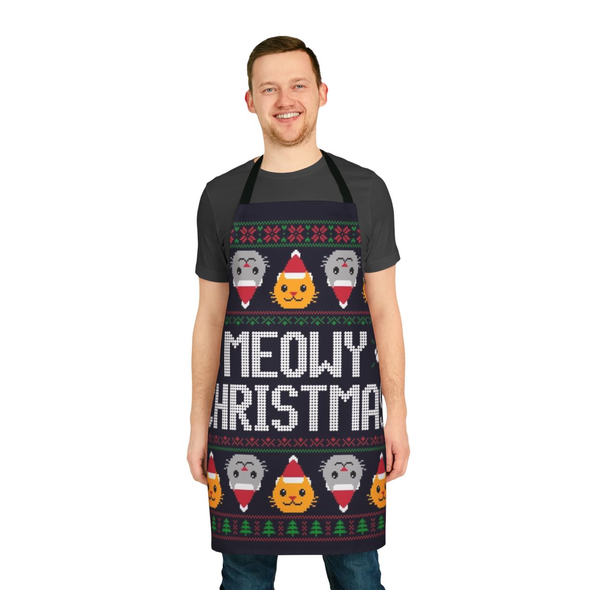 A yellow and green cat-themed apron with an ugly Christmas sweater print, featuring holiday elements like gingerbread men, Santa hats, and snowflakes.
