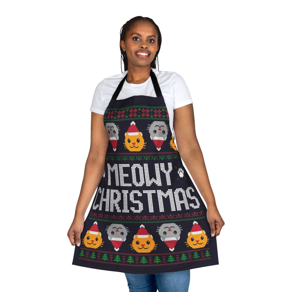 A yellow and green cat-themed apron with an ugly Christmas sweater print, featuring holiday elements like gingerbread men, Santa hats, and snowflakes.