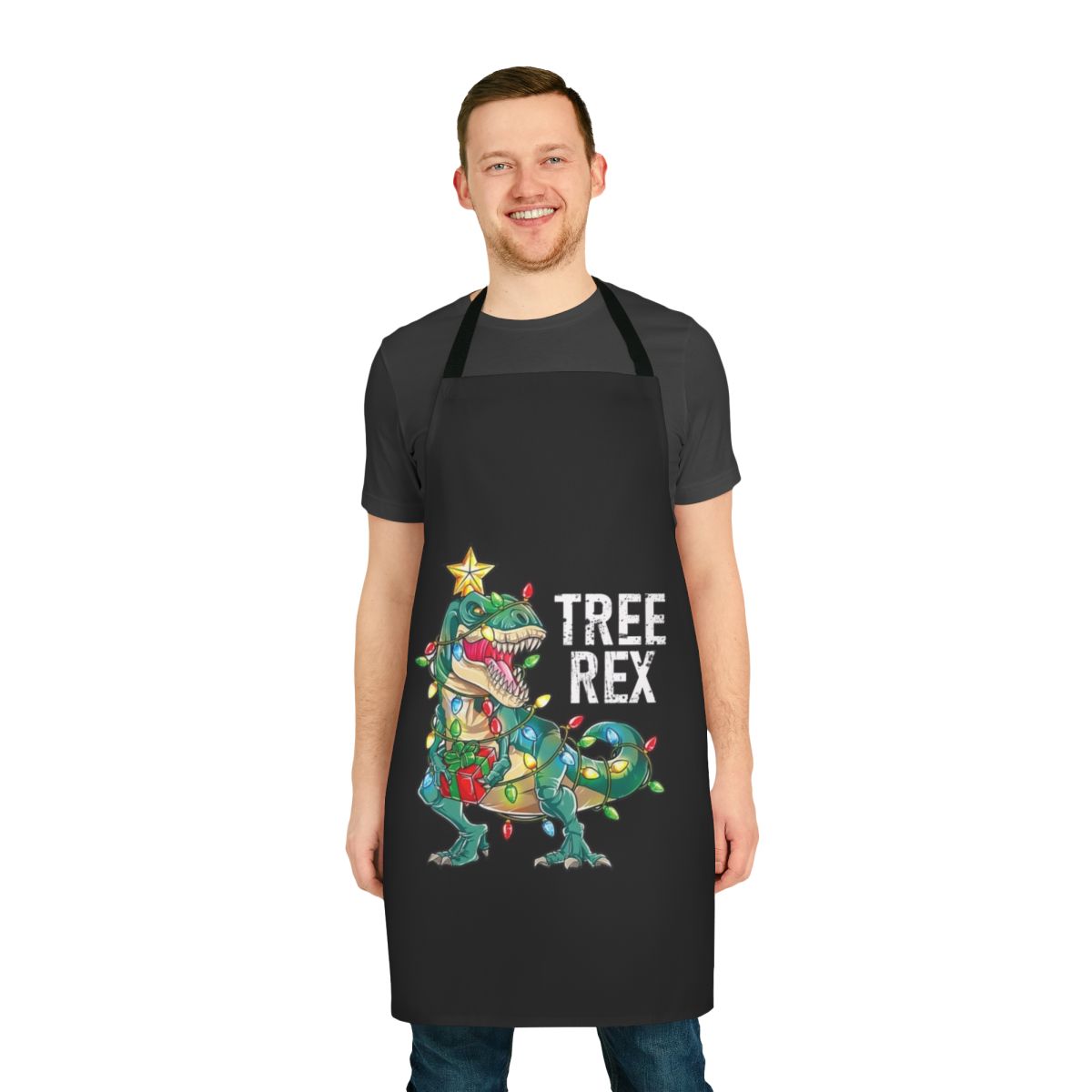 A festive apron featuring a Christmas-themed dinosaur tree rex design