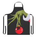 A green and red apron featuring a cartoon Grinch character, perfect for the holiday season