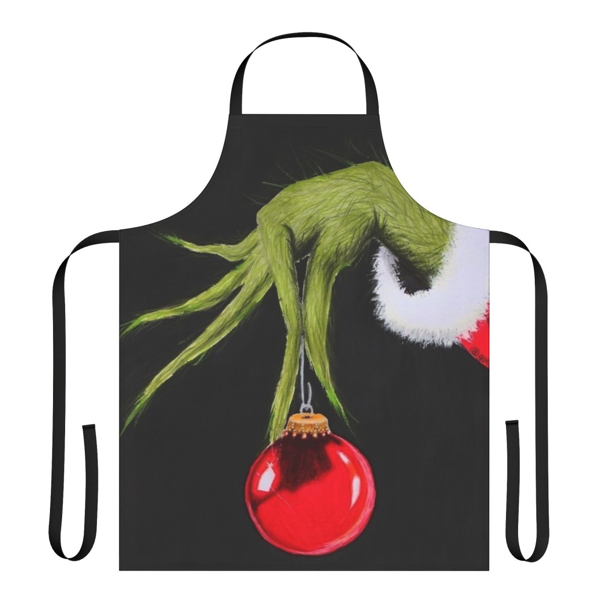 A green and red apron featuring a cartoon Grinch character, perfect for the holiday season