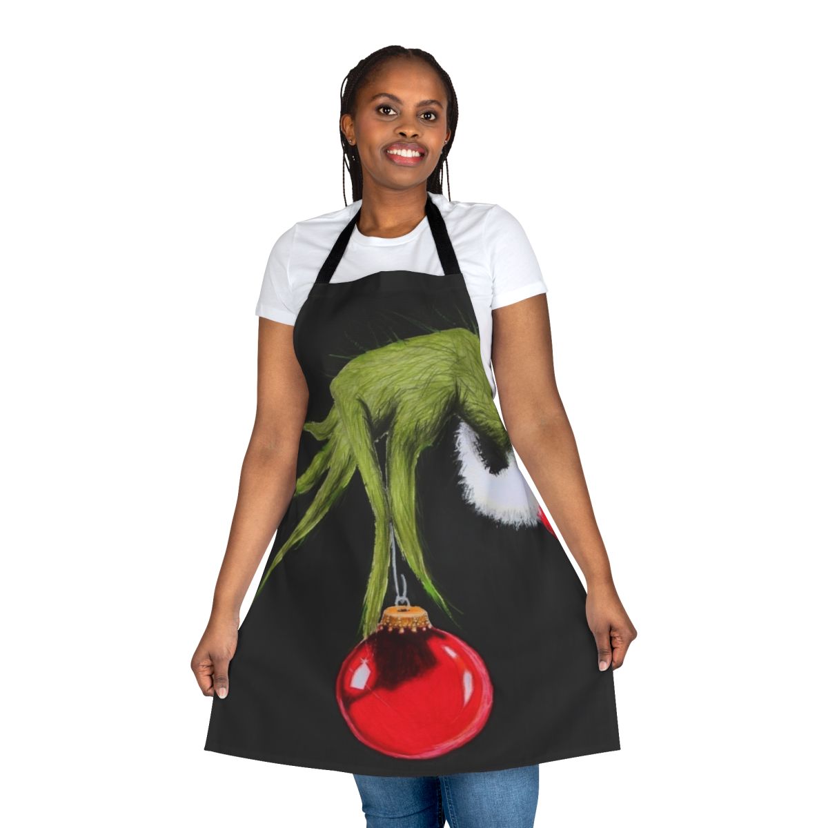 A green and red apron featuring a cartoon Grinch character, perfect for the holiday season