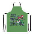 A whimsical holiday apron featuring a mermaid design, perfect for Christmas baking and cooking.