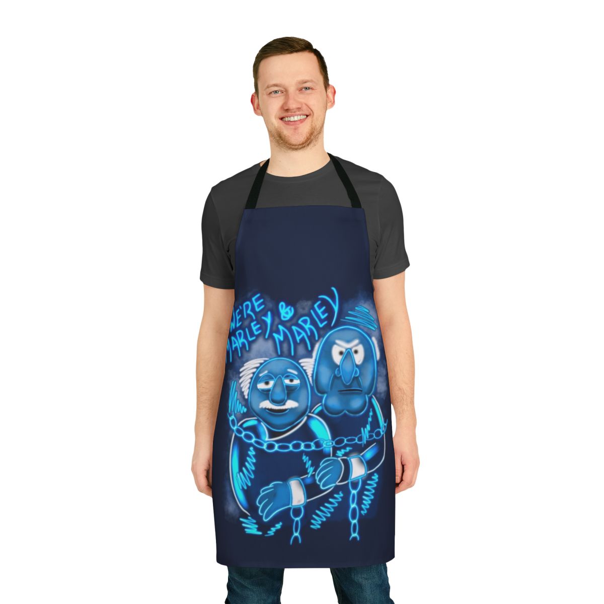 A festive apron featuring characters and imagery from the beloved Muppet Christmas Carol film.