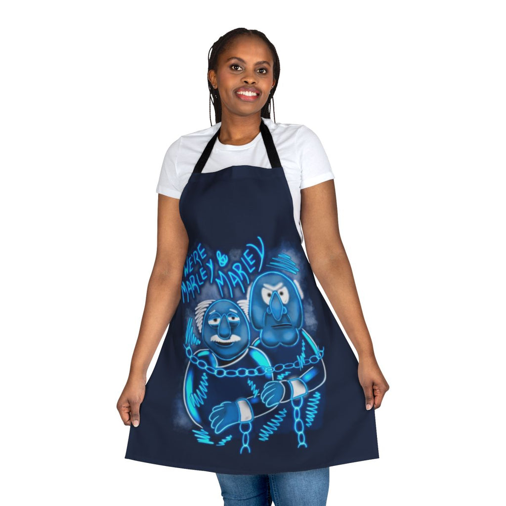 A festive apron featuring characters and imagery from the beloved Muppet Christmas Carol film.