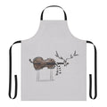 Christmas-themed apron featuring a reindeer playing a violin against a snowy backdrop