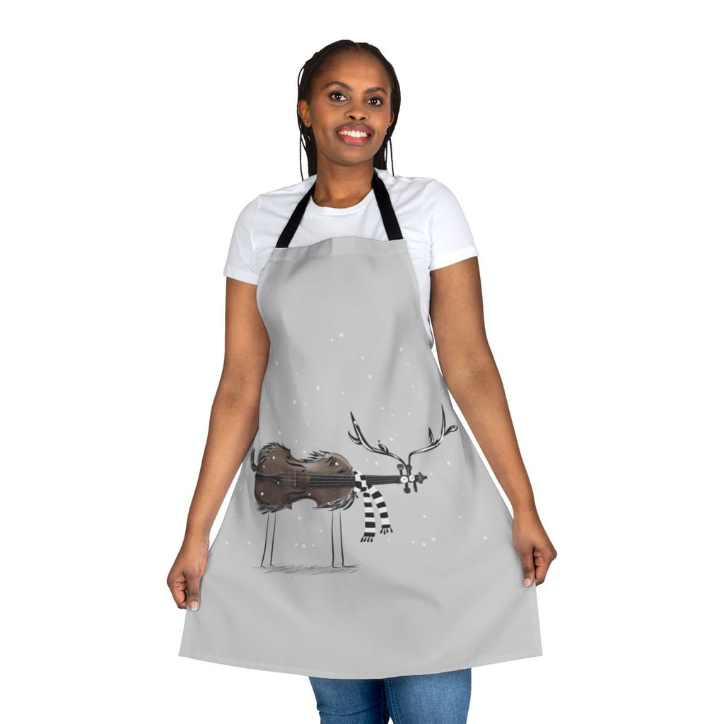 Christmas-themed apron featuring a reindeer playing a violin against a snowy backdrop