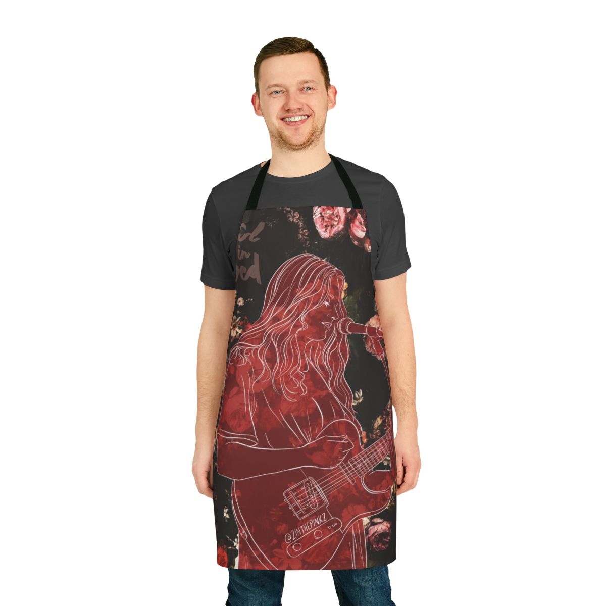 A red and rose patterned apron inspired by the music of the artist "Girl in Red"