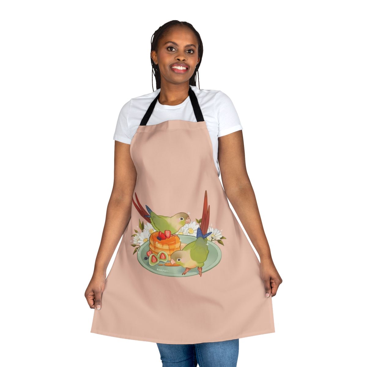 A green conure bird printed on a white apron with a pancake breakfast design