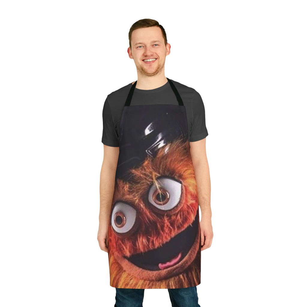 An orange apron featuring the Philadelphia Flyers' quirky mascot, Gritty, with a bold and humorous design.