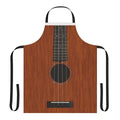 Person wearing apron featuring a ukulele design