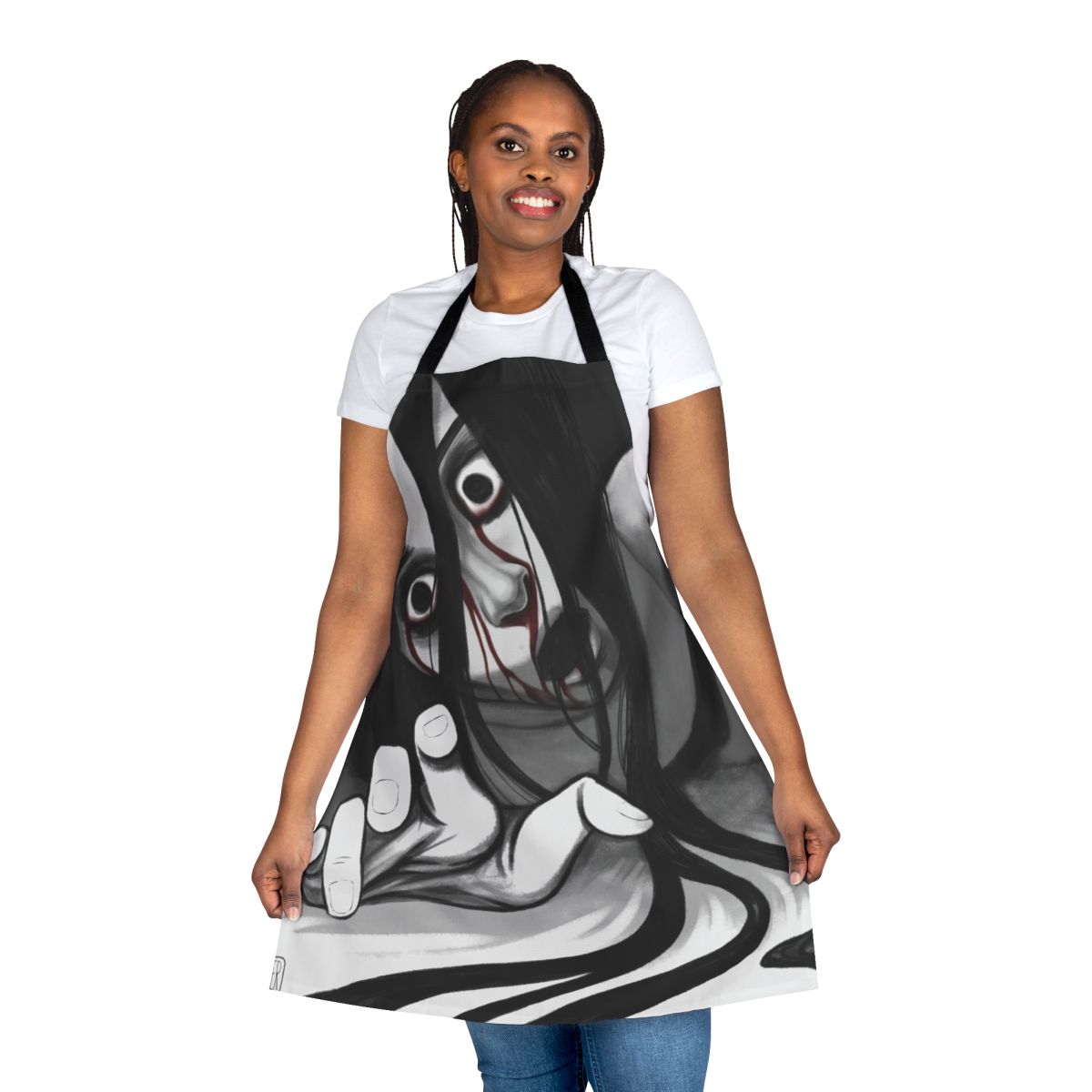 Illustration of Kayako Saeki, the terrifying ghost from the "Ju-On" horror franchise, featured on a black and white apron
