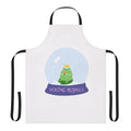 A snow globe-themed apron featuring the characters Wilhelm and Simon from the Swedish drama series Young Royals.