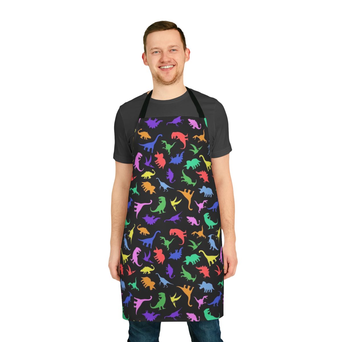 A black apron with a vibrant, colorful dinosaur pattern design.