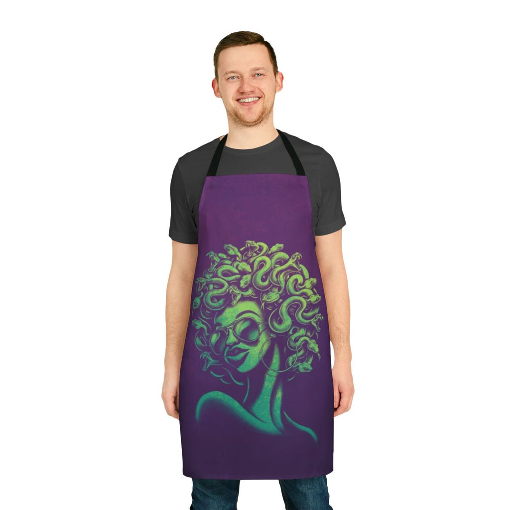 A funky, retro-style apron featuring a mythical Medusa-inspired portrait design with an afro hairstyle and cool sunglasses.