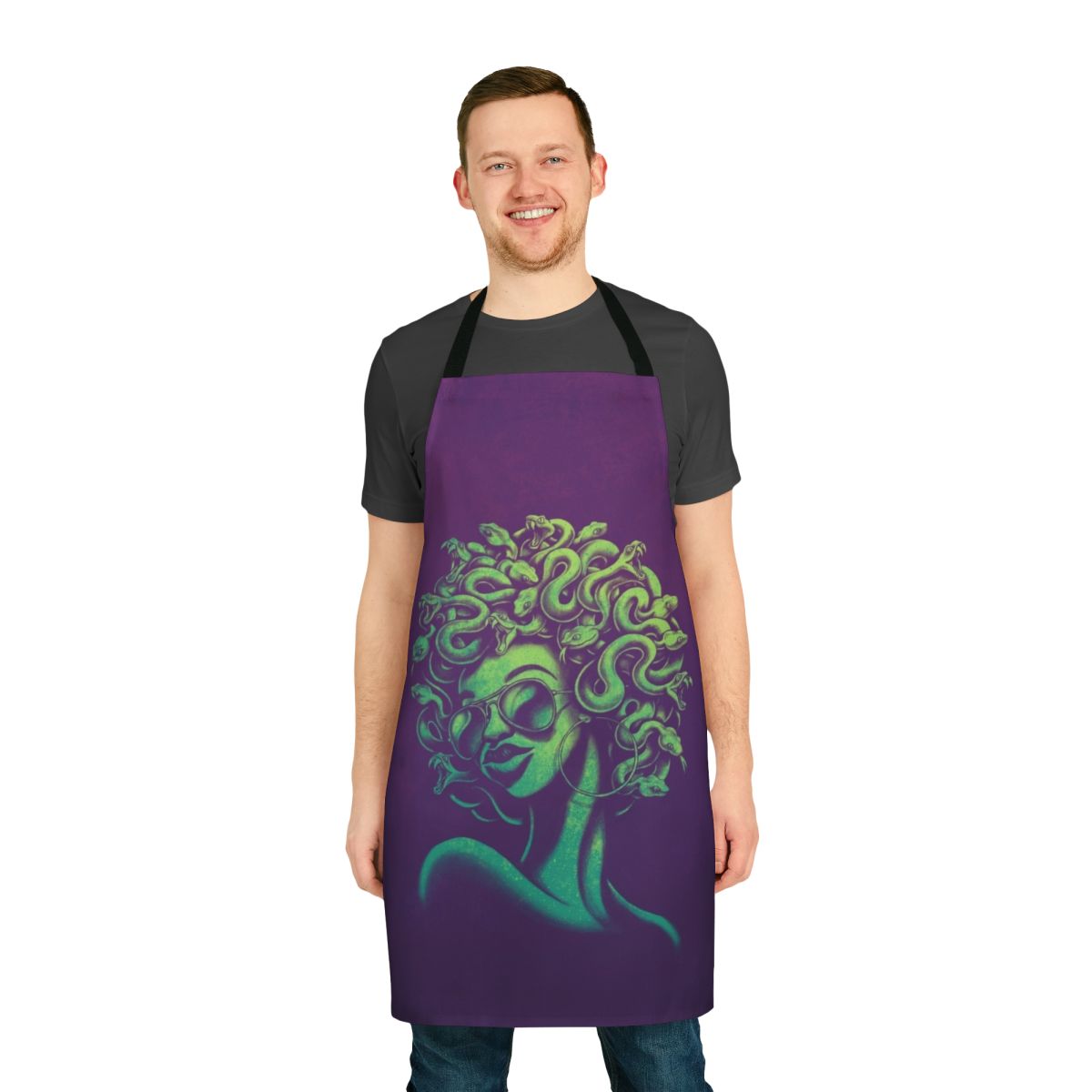 A funky, retro-style apron featuring a mythical Medusa-inspired portrait design with an afro hairstyle and cool sunglasses.
