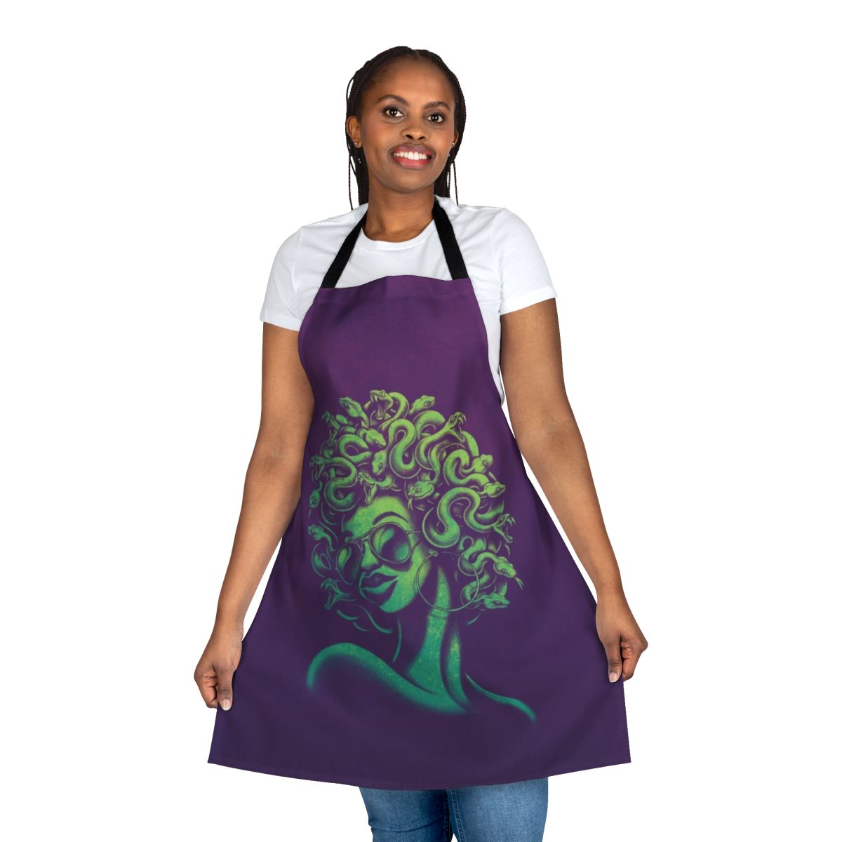 A funky, retro-style apron featuring a mythical Medusa-inspired portrait design with an afro hairstyle and cool sunglasses.