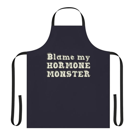 A black apron with an illustration of the Big Mouth hormone monster character from the Netflix animated series.