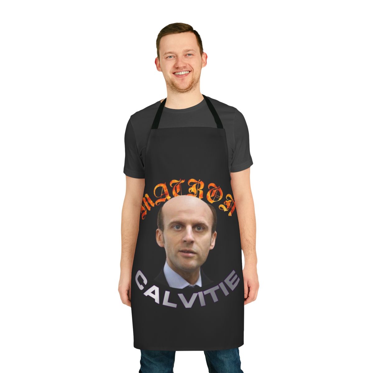 Comical apron with an image of French President Emmanuel Macron and a message about his baldness