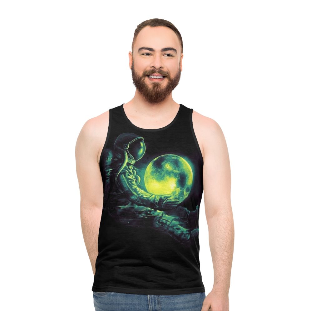 Unisex tank top with a cosmic, galactic design featuring a moon and astronaut
