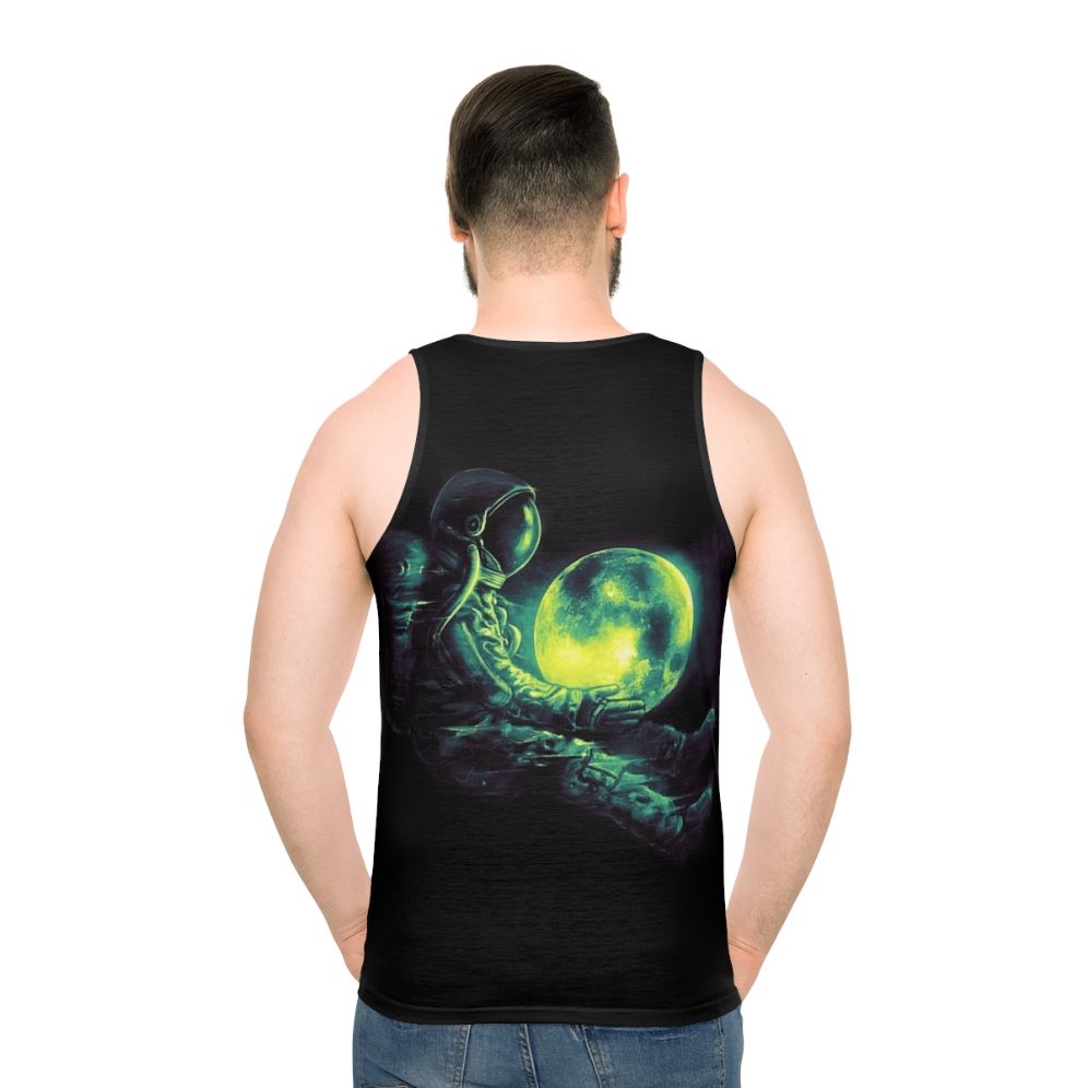 Unisex tank top with a cosmic, galactic design featuring a moon and astronaut