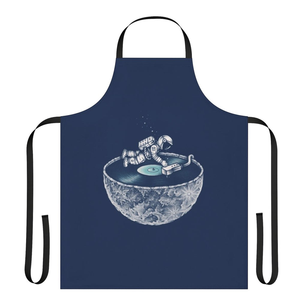 Person wearing a denim apron with a space and music themed design