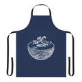 Person wearing a denim apron with a space and music themed design