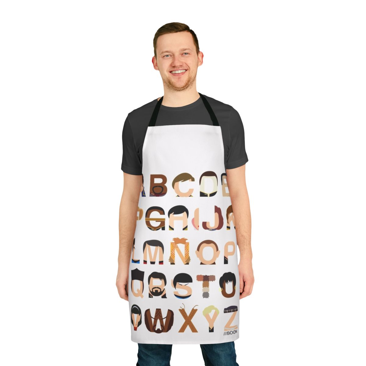 A black apron with a colorful print of the Star Trek alphabet