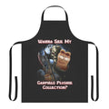 A dark and quirky apron featuring a collection of Garfield plushies, skulls, and other macabre elements.
