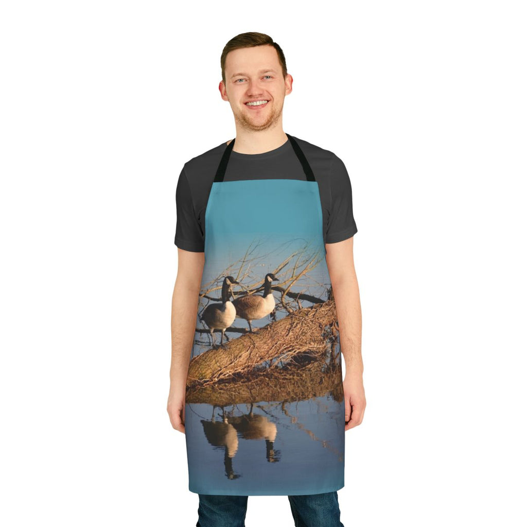 Apron featuring a beautiful image of geese swimming on a tranquil lake