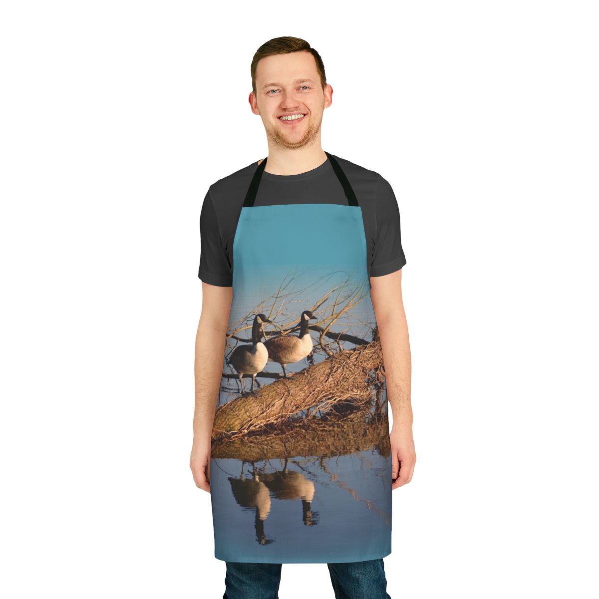 Apron featuring a beautiful image of geese swimming on a tranquil lake