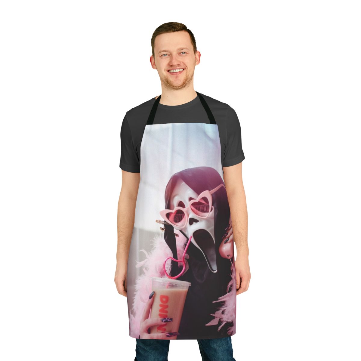 A ghostly black and white apron with the iconic Ghostface mask design, perfect for horror movie fans and home chefs.