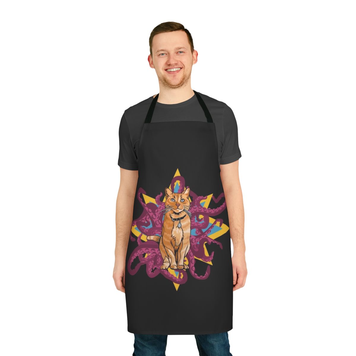 A black and white apron featuring the alien cat Goose from the Marvel Cinematic Universe movie Captain Marvel, with its signature tentacles emerging.