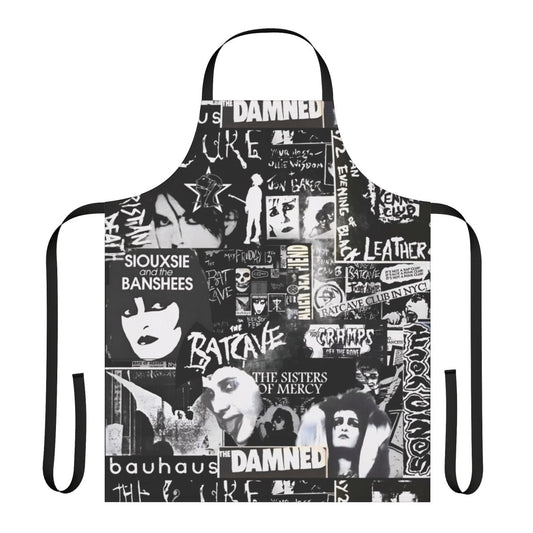 A black and white goth-inspired apron with a collage-style design featuring bats, The Cure, and Siouxie.