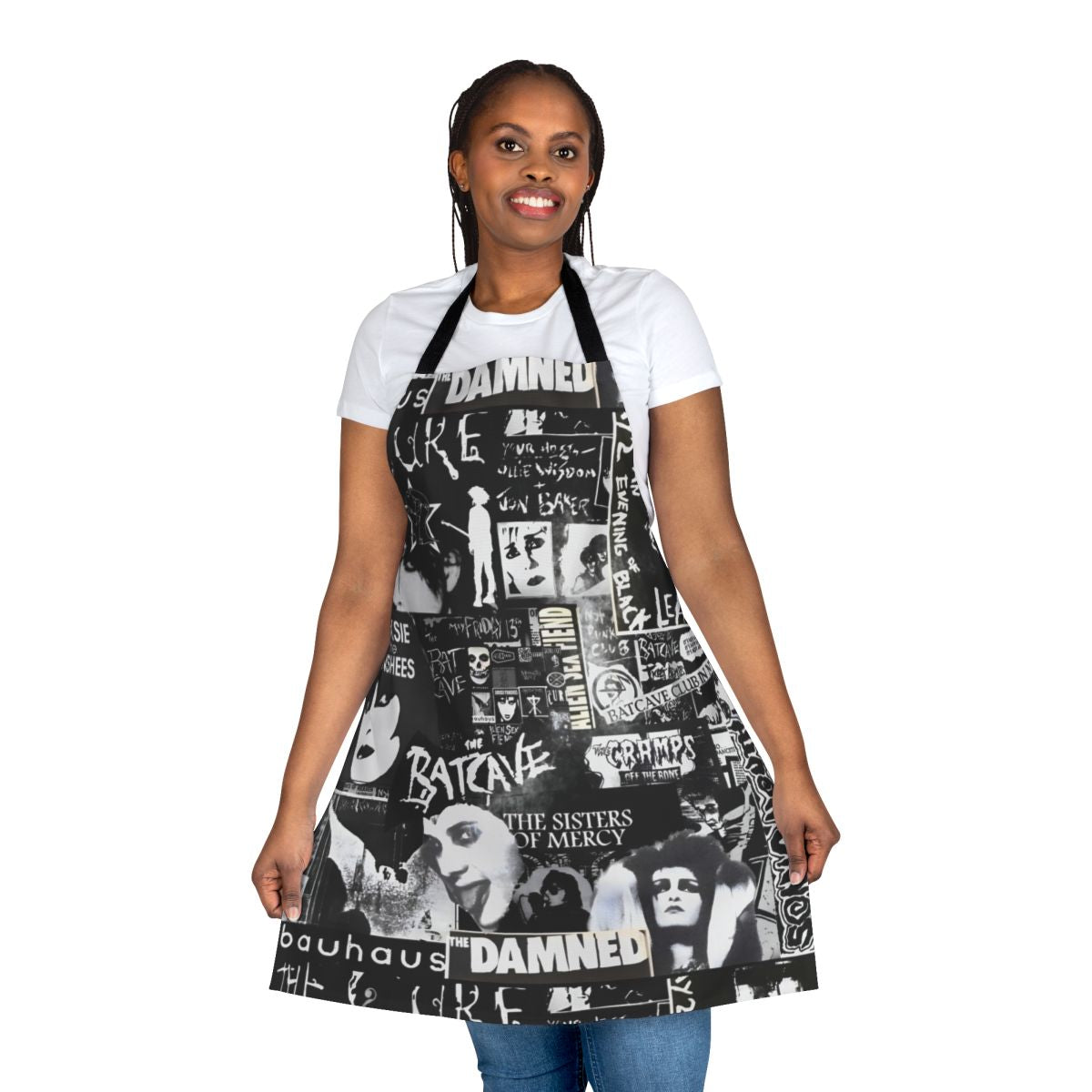 A black and white goth-inspired apron with a collage-style design featuring bats, The Cure, and Siouxie.