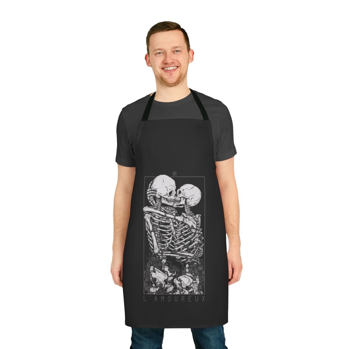 A dark and romantic apron featuring gothic imagery of skulls, flowers, and a couple in embrace.