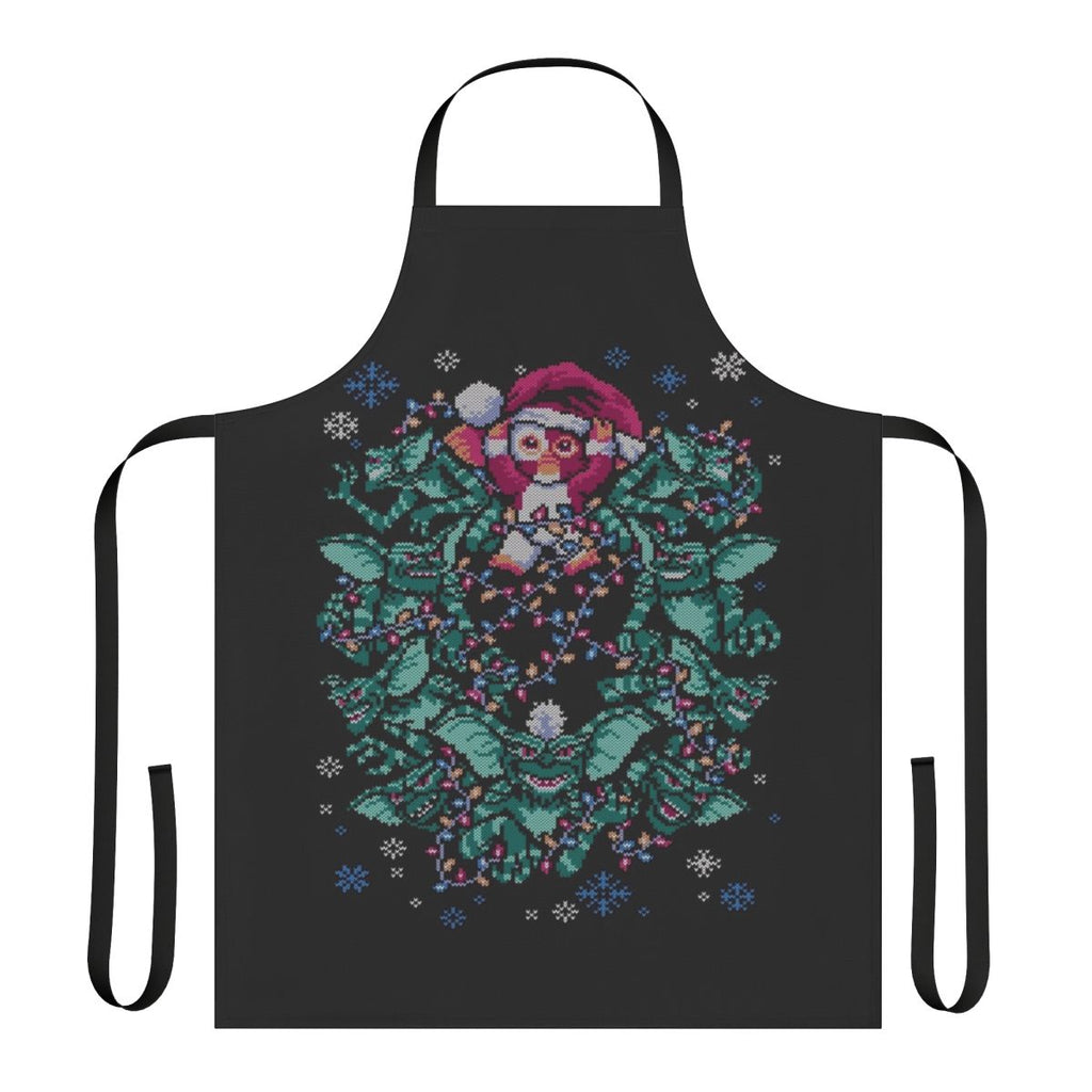 An apron featuring a gremlin-inspired Christmas design with a retro 80s horror movie theme.