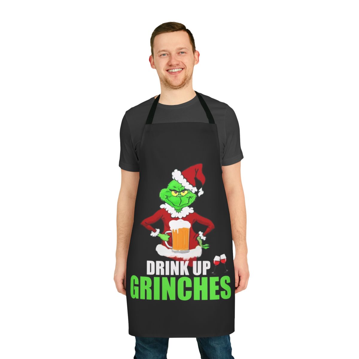 A festive apron featuring a "Drink Up Grinches" design, perfect for holiday cooking and entertaining.