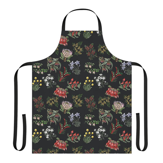 Handcrafted lino print apron featuring vibrant native Australian flowers and foliage.