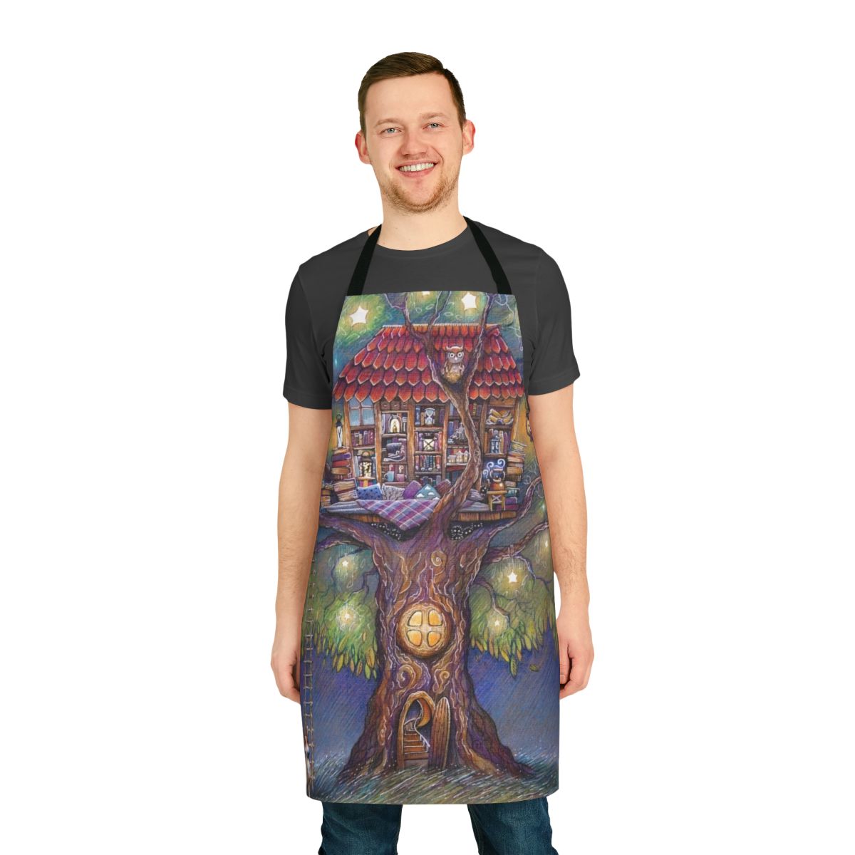 A whimsical, tree house-themed apron with illustrations of trees, stars, and cozy home elements