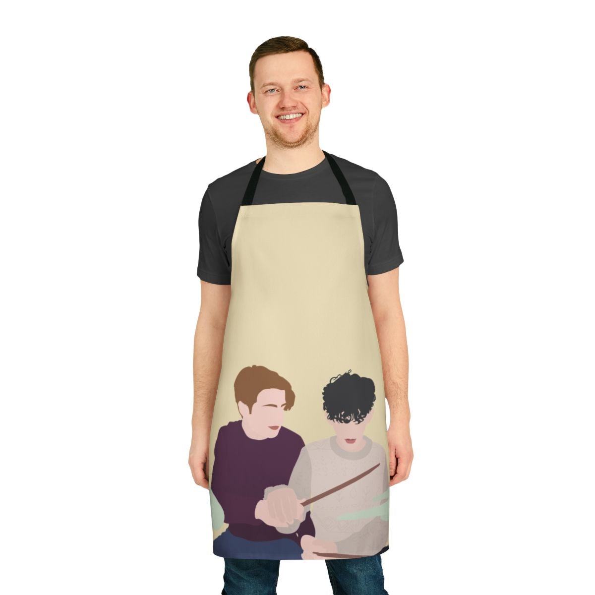 Heartstopper-themed apron featuring illustrations of Nick and Charlie playing drums