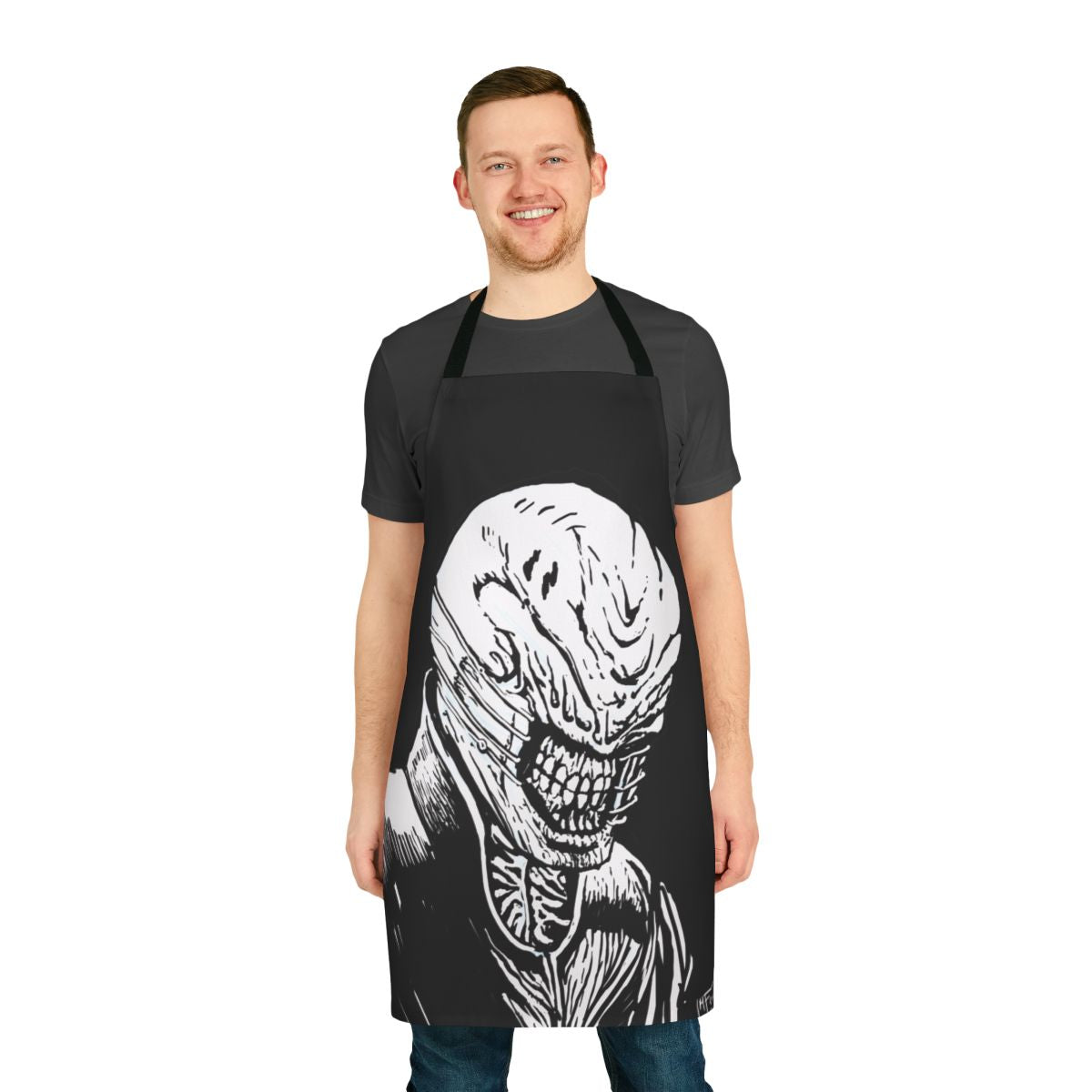 A dark and sinister-looking kitchen apron with the iconic Chatterer Cenobite face from the Hellraiser horror franchise.