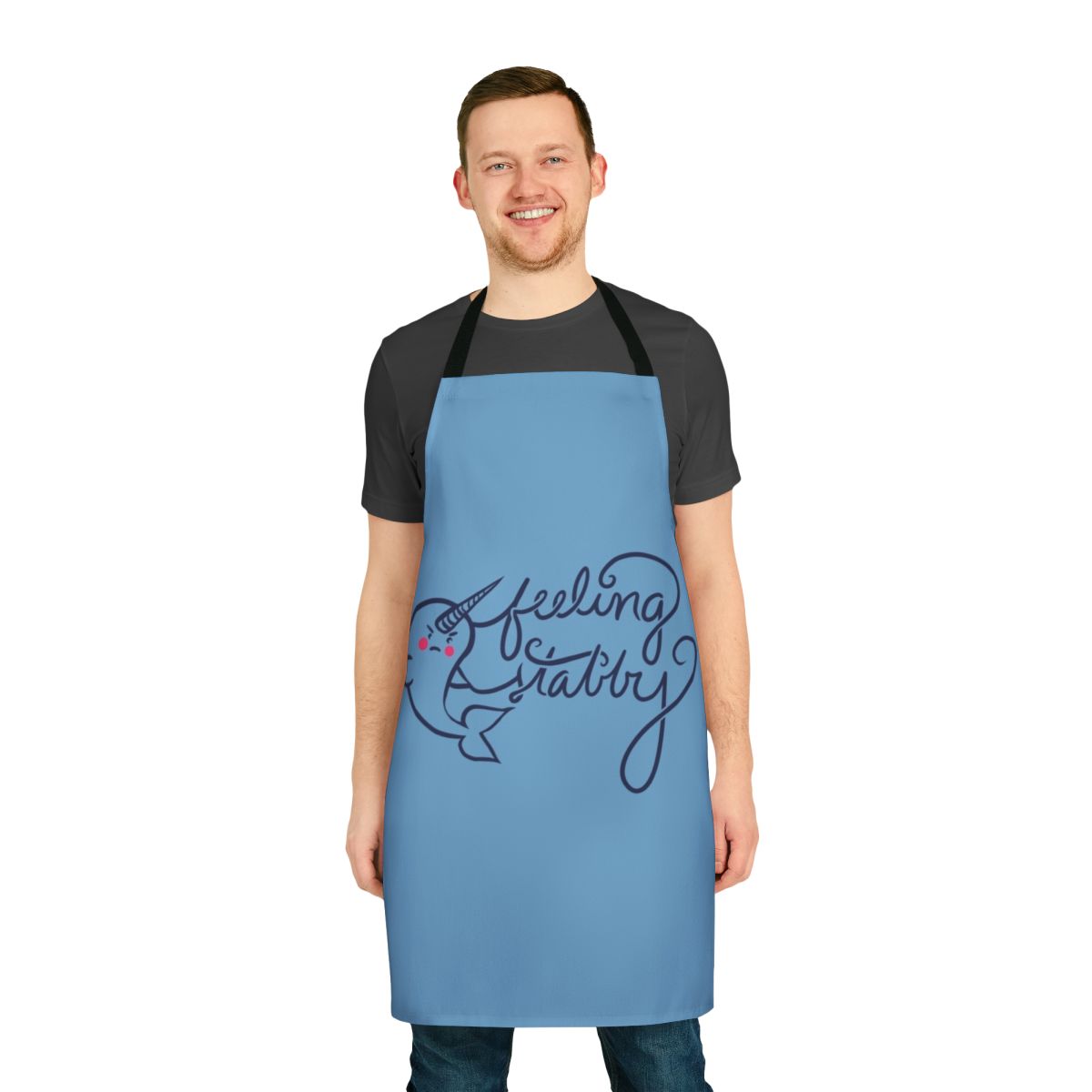 Illustration of a smiling narwhal on a white apron
