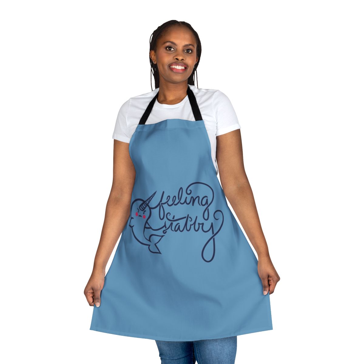 Illustration of a smiling narwhal on a white apron