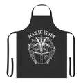 Person wearing an apron with a book and reading-themed design